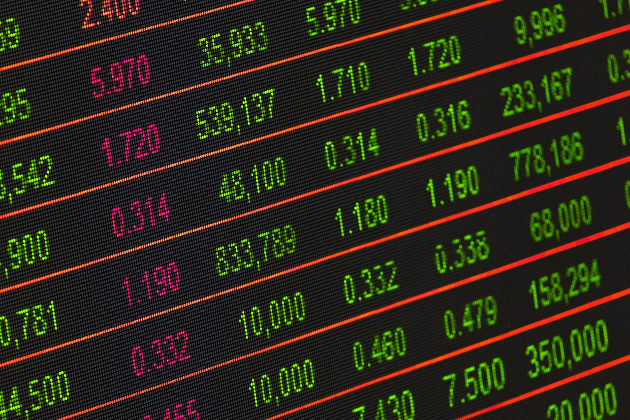 A digital screen featuring stock market quotes, highlighting current prices and market fluctuations.