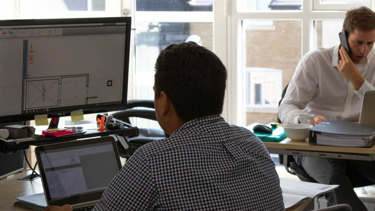 Quantity surveyors reviewing plans.