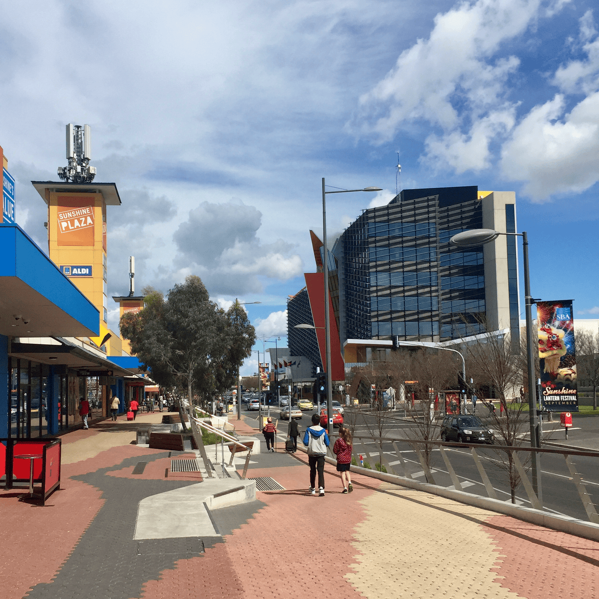 Hampshire Rd, Sunshine town centre, looking southwards. Brimbank Council head offices incorporating Sunshine Library are on the right. Sunshine Plaza is on the left.