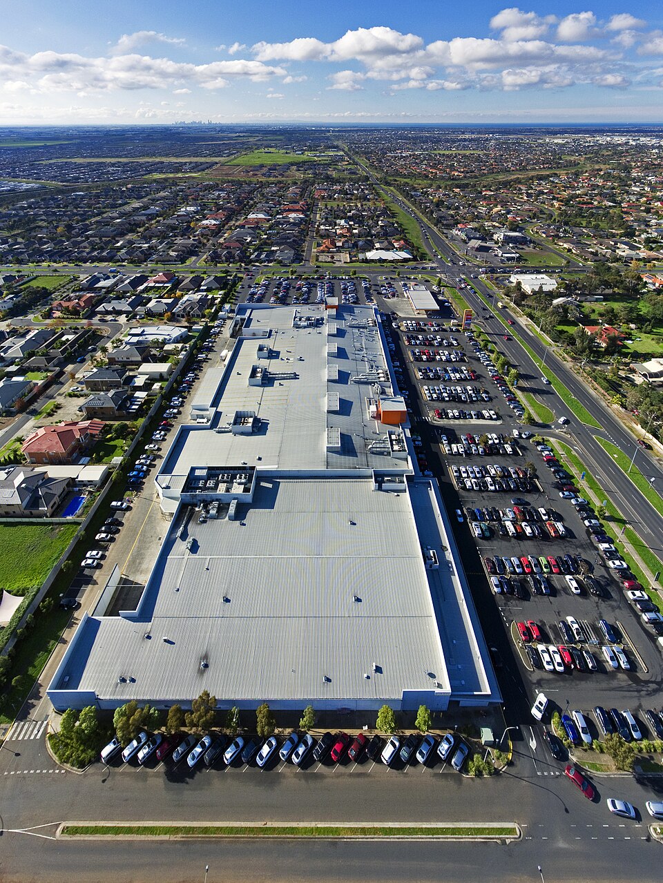 Vertical aerial panorama of Wyndham Village Shopping Centre.